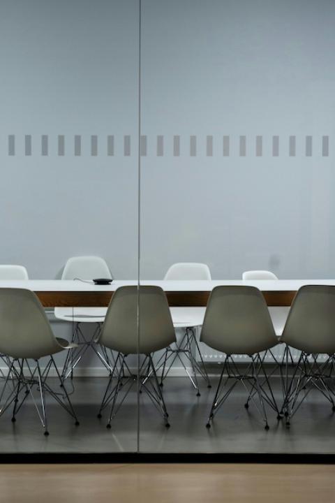 An empty boardroom table — sustainability reporting